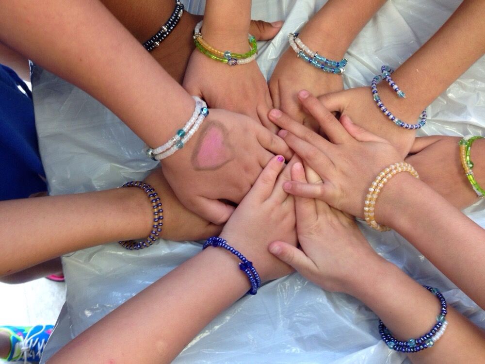 Happy kids exploring art during a lively pottery painting birthday party in Englewood, NJ