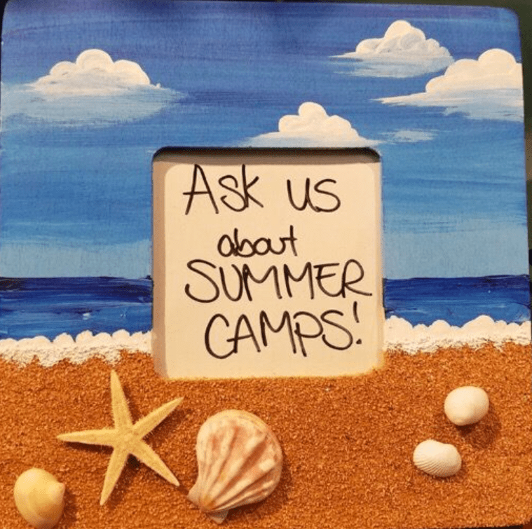Custom-decorated picture frame art resembling a beach scene from a summer camp project in Englewood, NJ